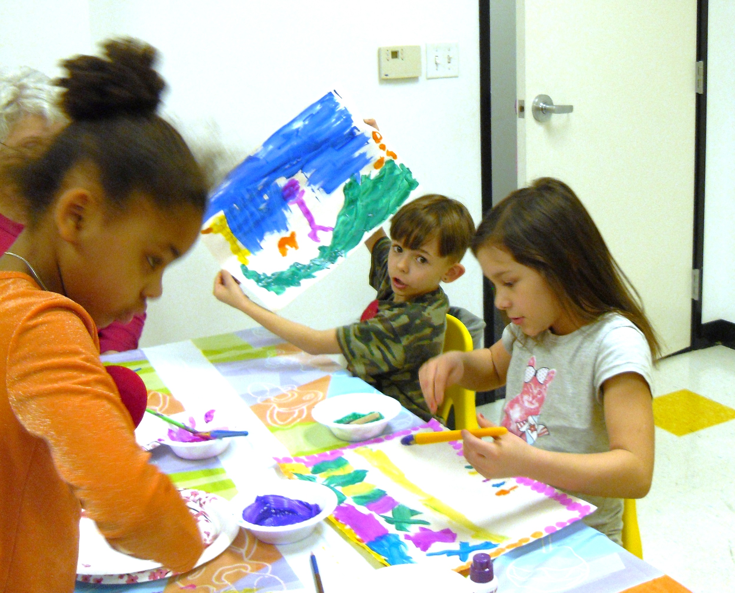 Image of children painting at Ele's Place.